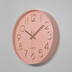 12-inch silent plastic wall clock with 3D gold numerals and coral pink matte finish