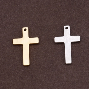 Minimalist gold and silver cross pendants for DIY necklaces on a textured background