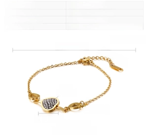 Detail of gold stainless steel heart bracelet with micro-paved zircons and 45mm extender
