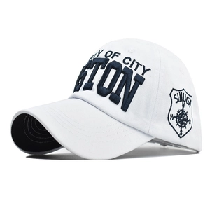 White Boston baseball cap with 3D navy embroidery and side shield badge on white background
