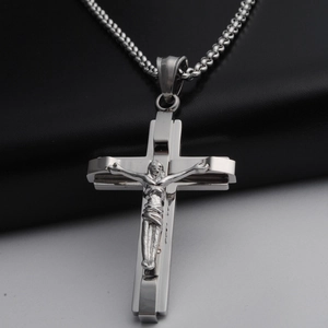 Polished stainless steel crucifix cross pendant necklace for men and women on bicolor background