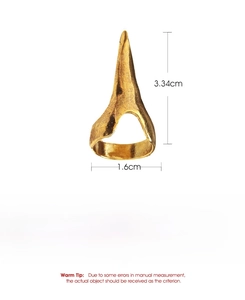 Macro detail of punk rock claw ring showing vintage gold texture and exact dimensions