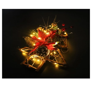 Star-shaped wooden Christmas wreath with red poinsettia, pine cones, and warm LED lights