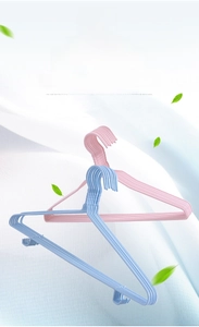 Close-up of non-slip dipping metal hangers in pink and blue with utility side hooks