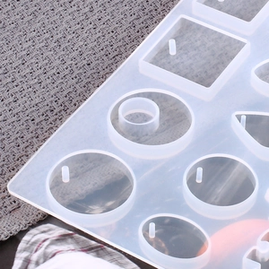 Detailed view of clear silicone jewelry molds with round and oval shapes for DIY crafts