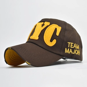 Close-up of distressed brim detail and yellow NYC felt embroidery on dark brown cotton cap