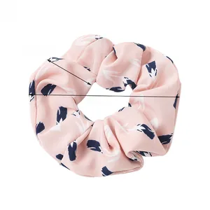Floral scrunchie detail showing 12cm outer diameter and soft pink pineapple fabric