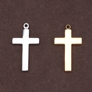 Minimalist religious cross pendants in gold and silver steel with smooth metallic finish