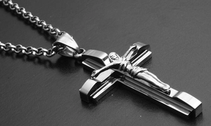 Detailed close-up of a silver stainless steel crucifix pendant on a sturdy link chain