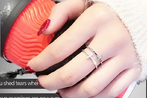 Detail of silver double-layer cross ring with micro-paved rhinestones on open band