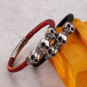 Punk woven leather bracelets with silver skull charms and magnetic clasp in red and black
