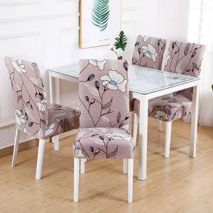 Dining room setting with chairs in light purple floral stretch fabric covers