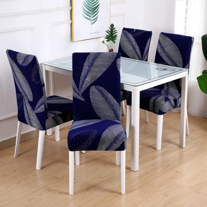 Detail of navy blue stretch chair cover featuring a large silver feather pattern print