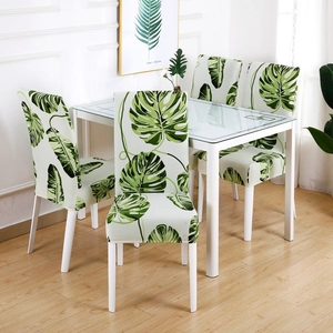 Modern stretch dining chair covers with green tropical leaf prints in a set of 4