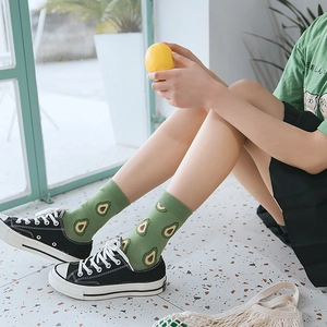 Women's green cotton socks with cartoon avocado pattern in a casual street style look