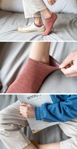 Detail view of breathable cotton invisible socks in brick red and mustard yellow colors