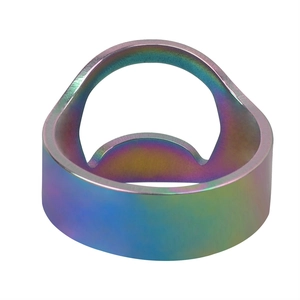 Macro shot of rainbow-plated stainless steel bottle opener ring with cutout design