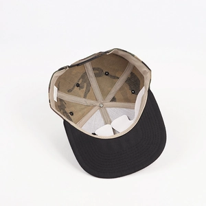 Detail view of snapback interior showing 100% acrylic material label and sweatband