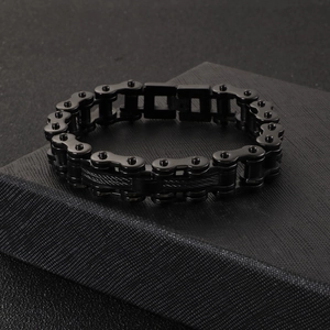 Men's black stainless steel motorcycle chain bracelet displayed on a premium jewelry box