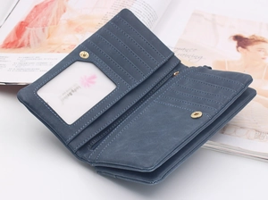 Detailed view of the dark blue long wallet interior with multiple card slots and zip pocket