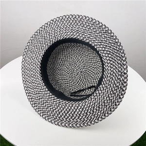 Flat top straw sun hat with black and white woven pattern for outdoor sun protection