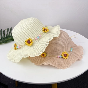 Straw sun hats for girls with sunflower decor and wavy lace edges in cream and light brown