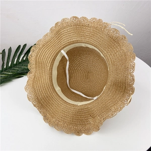 Handmade straw sun hat for girls with wavy brim and elastic wind rope for sun protection