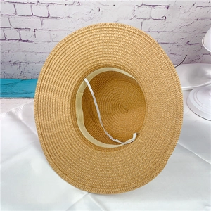 Light brown woven straw sun hat with inner adjustable rope and wide brim for beach