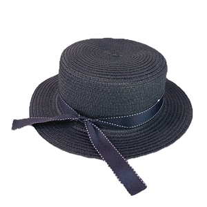 Classic black flat top straw sun hat with decorative dotted bow ribbon for women