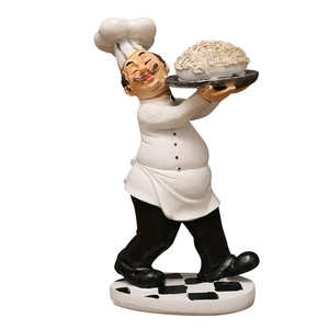 Vintage chef resin statue holding a plate of noodles on checkerboard base for kitchen decor