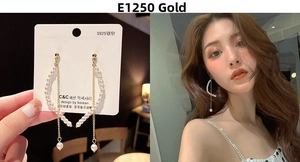 Detail of long pearl tassel earrings featuring gold chains and S925 silver needles