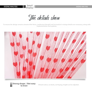 Detail of red heart string curtain showing fine white thread texture and smooth drape