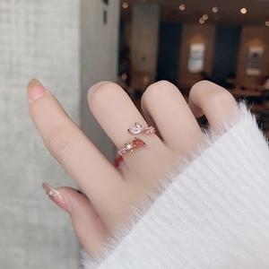 Rose gold adjustable ring with red crystal and marquise zircon in a floral design