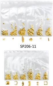 Detail of assorted golden metal nail art charms including stars and shells in bags