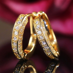 U-shaped gold-plated hoop earrings with double row paved cubic zirconia stones