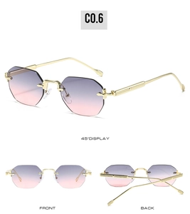 Detail view of rimless octagon sunglasses with purple gradient lenses and gold metal temples