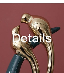 Detailed close-up of golden electroplated and dark green glazed ceramic bird figurine