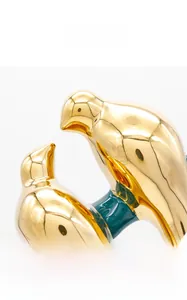 Detail view of bird ceramic decor with glossy emerald glaze and gold plated finish