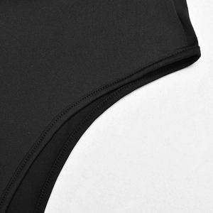 Close-up of black mesh fabric texture and precise stitching on the bodysuit's edge