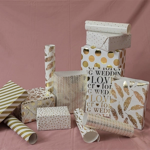 Gold foil gift wrapping paper set with polka dots and love hearts for birthdays