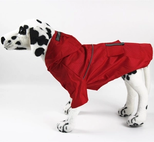Detail view of red waterproof pet raincoat with reflective safety stripes and hood
