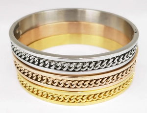Three-piece stackable chain bracelets in gold, silver, and rose gold stainless steel