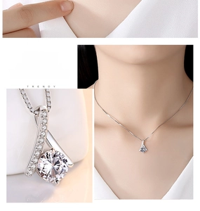 Macro detail of S925 silver interwoven pendant with round cubic zirconia on box chain