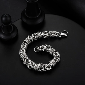Men's titanium steel silver woven chain bracelet on black plate with chess piece