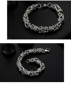 Detailed view of silver titanium steel hip hop bracelet with woven texture and lobster clasp