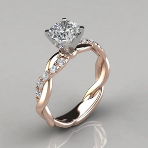 Macro detail of rose gold and silver ring with princess cut diamond and twisted band
