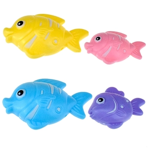 Detailed view of colorful plastic toy tropical fish in yellow, pink, blue, and purple