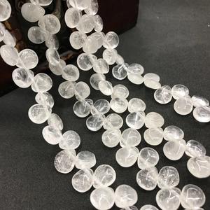 Macro shot of transparent crystal quartz teardrop beads for handmade jewelry making