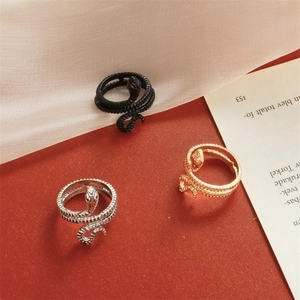 Retro snake ring set in gold, black and silver finishes with realistic scale textures