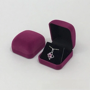 Macro view of purple velvet jewelry gift boxes with soft lining for necklace and earrings